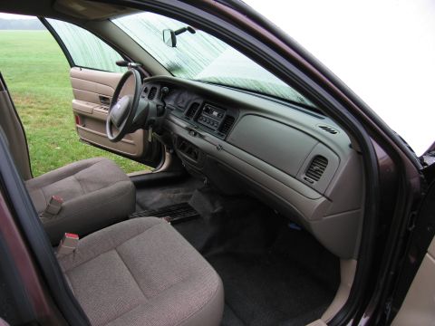 1991 Ford LTD Crown Victoria - The interior of a car is visible, the dashboard, steering wheel, and front seats.