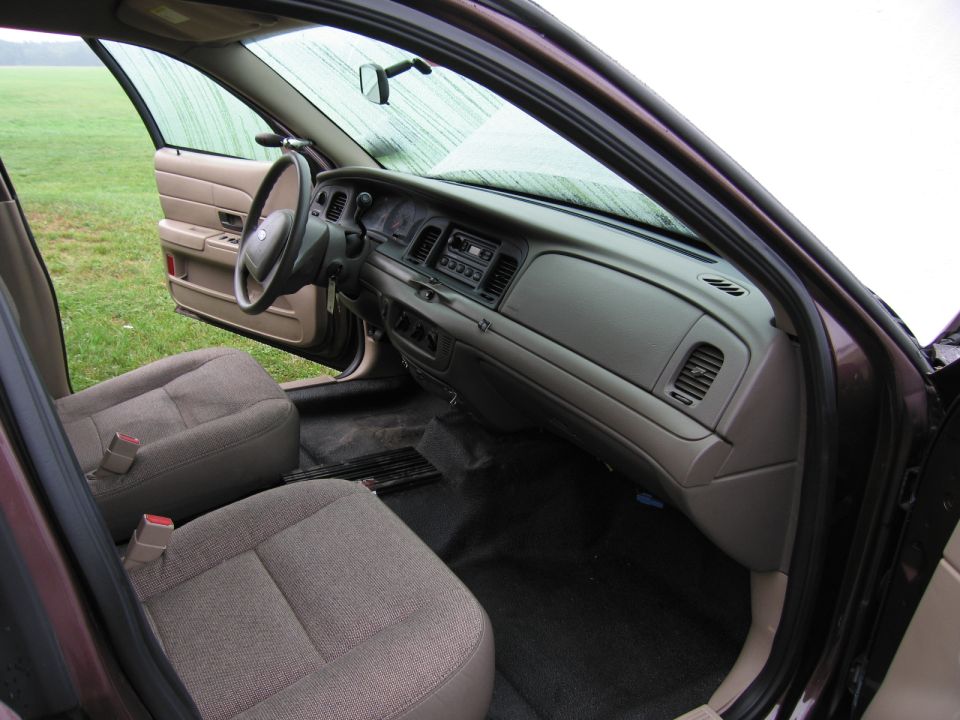 Interior view of a car showing dashboard, steering wheel, and seats