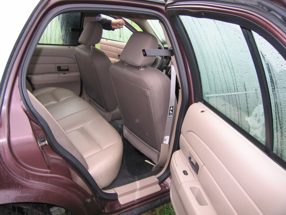 Interior of a 1991 Ford Crown Victoria LTD showing tan leather seats and door panels