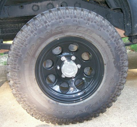 1993 Ford Bronco - Aftermarket wheel and tire assembly, likely for an off-road vehicle.