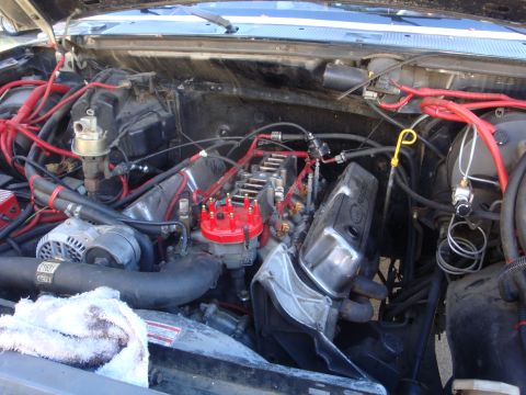 1989 Ford Bronco - Close-up view of a V8 engine bay, showing various components and wiring.