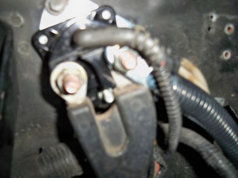 1995 Ford F-150 - Close-up view of a starter solenoid and associated wiring harness, likely from an engine bay.