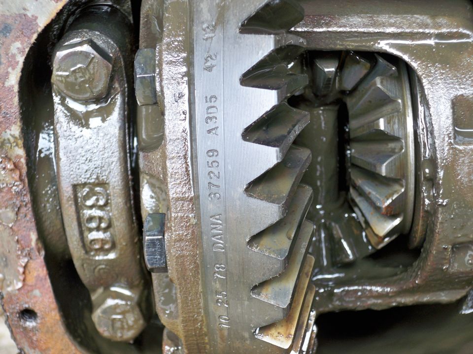 Close-up of differential gears with DANA 37259 A3D5 and date 10 25 78 stamped on the ring gear