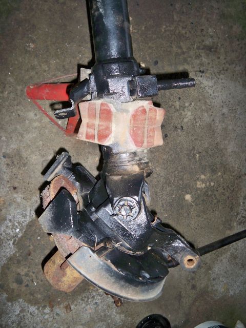 1995 Ford F-150 - Close-up of a driveshaft U-joint and yoke assembly, likely for a vehicle repair or rebuild.