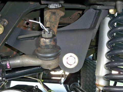 1995 Ford F-150 - Detail of a vehicle's steering and suspension components, including a ball joint and tie rod end.