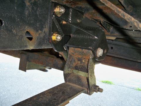 1995 Ford F-150 - Aftermarket bracket installed on a vehicle's frame, showing rust on the original components.
