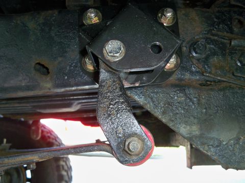 1995 Ford F-150 - This image shows a custom suspension part, likely an aftermarket modification, attached to the underside of a vehicle.