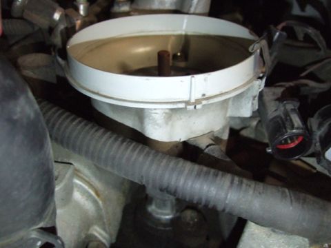 1995 Ford Mustang - Engine distributor cap detail, part of a larger automotive system.