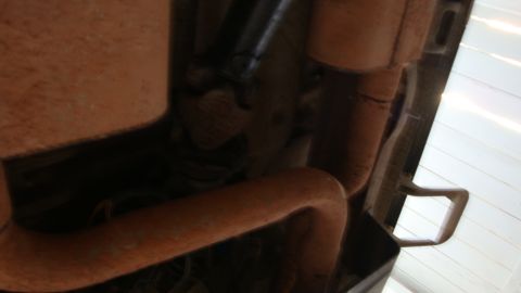 1994 Ford Bronco - Underside view of a vehicle's exhaust system components.