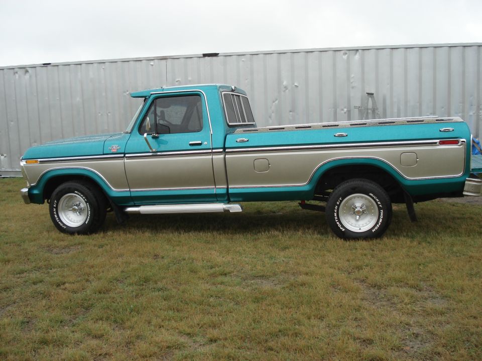 Teal and tan 1979 Ford F-150 pickup truck, side view