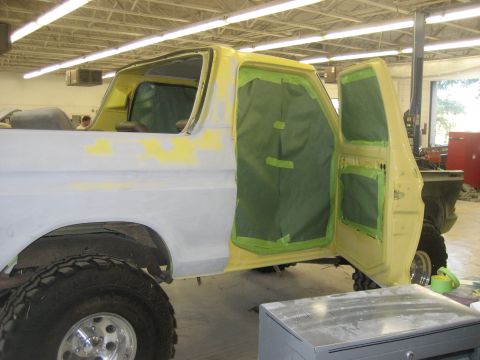 1978 Ford Bronco - 1978 Ford Bronco bodywork in progress, doors open and masked for painting.