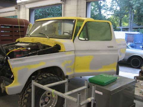 1978 Ford Bronco - A classic Ford Bronco is undergoing bodywork and paint preparation in a workshop.