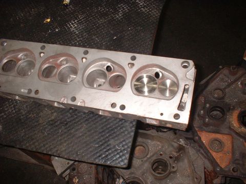 1964 Ford Galaxie - A close-up view of an engine cylinder head, showing the intake and exhaust ports.