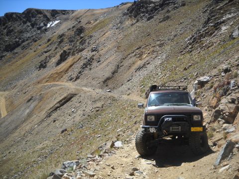 1986 Ford Bronco II - This 1986 Ford Bronco II navigates a steep, rocky mountain path, its off-road capabilities.