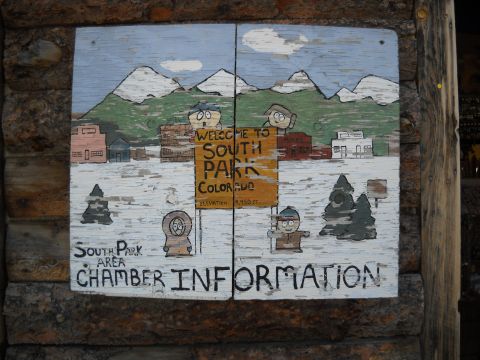 1986 Ford Bronco II - A rustic sign welcomes visitors to South Park, Colorado, depicting a snowy landscape and characters from the show.