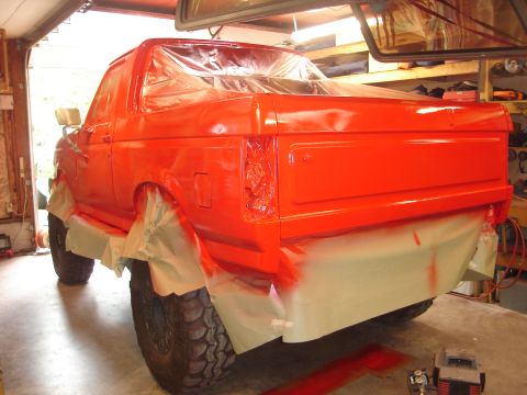 1989 Ford Bronco - This 1989 Ford Bronco is undergoing a repaint, with plastic covering the windows and masking paper protecting the lower body panels.