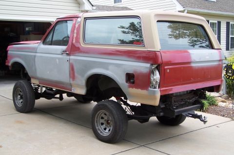 1990 Ford Bronco - This 1990 Ford Bronco is in the process of being restored, showing primer and red paint.