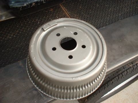 1963 Ford Galaxie - A close-up view of a silver brake drum, likely a replacement part for a vehicle.