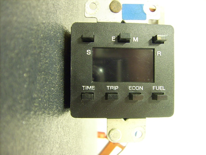 Digital instrument cluster with buttons labeled TIME, TRIP, ECON, FUEL, S, E, M, R
