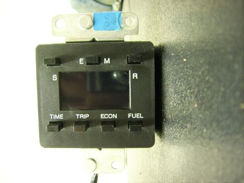 1988 Ford Crown Victoria LTD - Digital odometer display unit with multiple function buttons and a small LCD screen.
