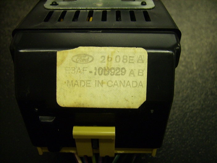 Ford electronic control module with label showing part number E3AF-10D929 AB and "MADE IN CANADA"
