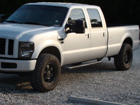 2008 Ford F-250 - Silver 2008 Ford F-250 pickup truck with aftermarket wheels and tires.