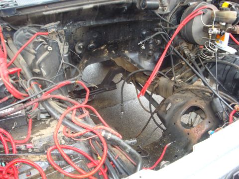 1989 Ford Bronco - Vehicle engine bay showing a complex wiring harness and brake system components.