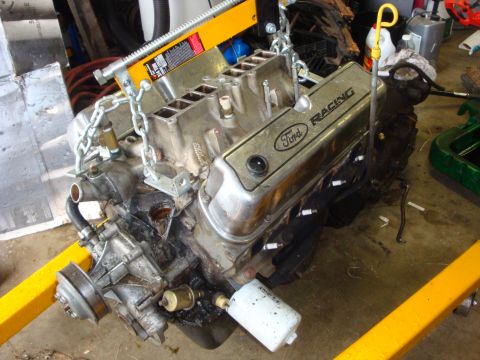 1989 Ford Bronco - Engine block and components are visible, with a Ford Racing valve cover and oil filter attached.