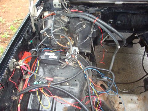 1989 Ford Bronco - Exposed wiring and components in an engine bay, a StreetWires control module.