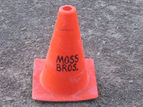 1990 Ford Bronco - small orange traffic cone hand-lettered with MOSS BROS sitting on a gravel surface.