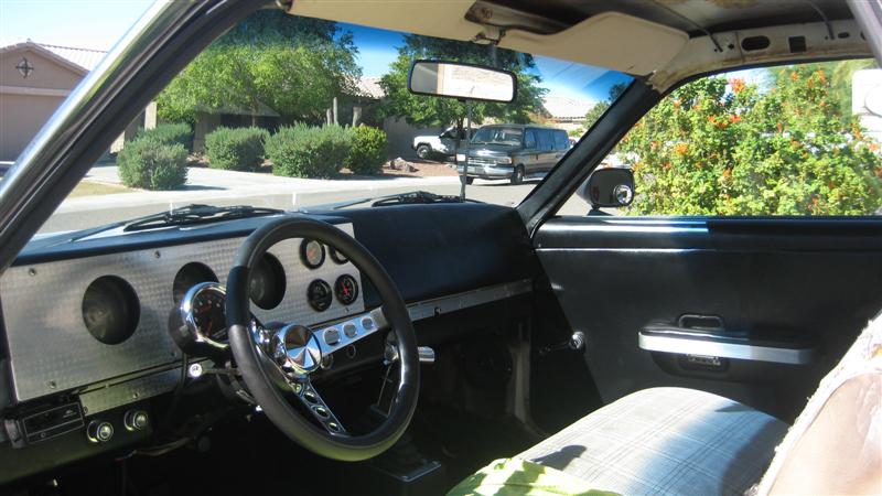 1968 Ford Ranchero interior with custom dash, aftermarket steering wheel, and aftermarket gauges