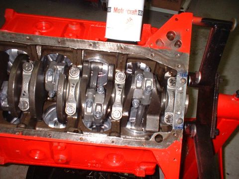 1955 Ford Thunderbird - Close-up view of an engine block's internal components, including the crankshaft and connecting rods.