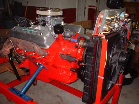 1955 Ford Thunderbird - A V8 engine assembly is shown on a stand, a carburetor, air cleaner, and radiator fan.
