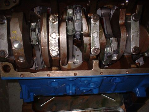 1967 Ford Mustang - Close-up view of an engine's internal components, including the crankshaft and connecting rods.