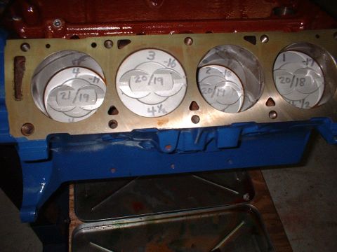 1967 Ford Mustang - Close-up view of engine cylinders with pistons and measurement markings visible.