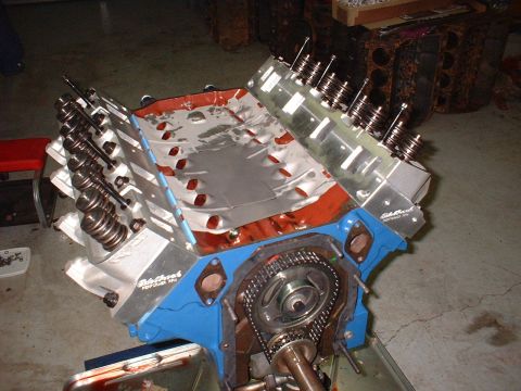 1967 Ford Mustang - Close-up of an engine block showing the timing chain and valve train components.