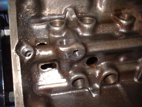 1967 Ford Mustang - This is a close-up view of a cast iron engine block, showing its internal structure and ports.