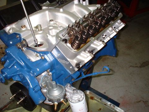 1967 Ford Mustang - Detail of an engine assembly, showing the valve train and attached fuel pump and oil filter.