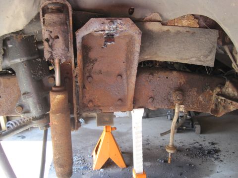 1979 Ford Bronco - Vehicle suspension components show significant rust and wear, indicating a need for repair or replacement.