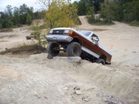 1989 Ford Bronco - This modified Ford truck navigates a challenging off-road obstacle course.