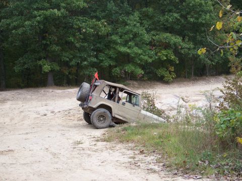 1989 Ford Bronco - This Jeep Cherokee XJ is navigating a challenging off-road course.