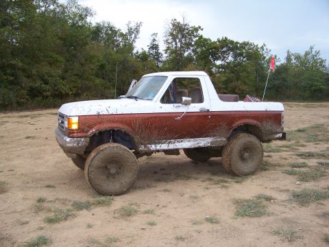 1989 Ford Bronco - This lifted 1989 Ford Bronco is covered in mud after an off-road excursion.