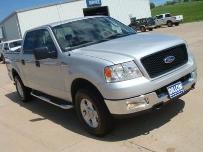 Silver Ford F-150 SuperCrew pickup at three-quarter front view on a dealer lot