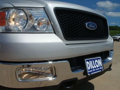 2004 Ford F-150 - Front view of a silver 2004 Ford F-150 pickup truck, showing the grille and headlights.
