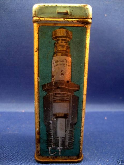 1915 Ford Model T - A diagram of a spark plug is depicted on a vintage tin.