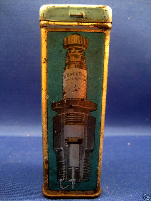 Tin box with a diagram of a cutaway spark plug labeled TUNGSTEN