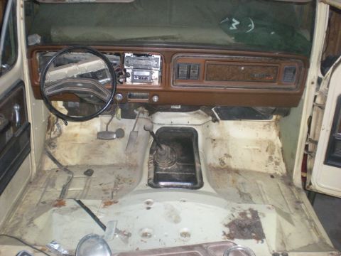 1978 Ford Bronco - Interior view of a 1978 Ford Bronco with the floor pan removed, ready for restoration.