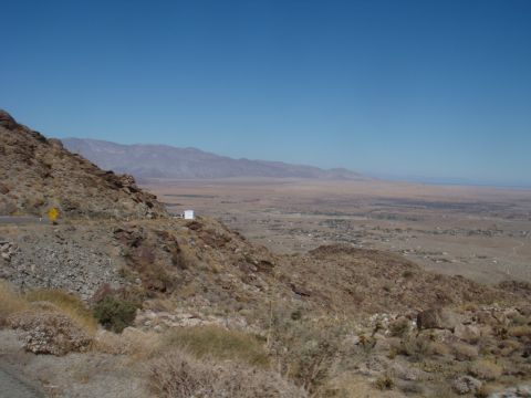 1992 Ford Bronco - A white box truck is visible on a mountain road with a vast desert landscape in the background.