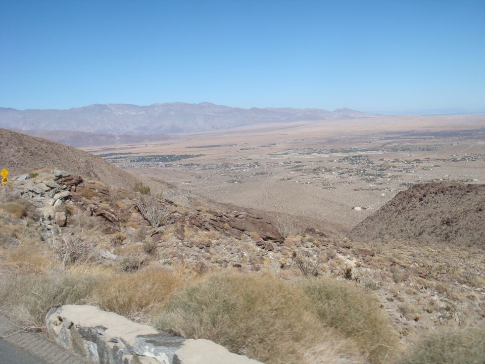 Desert landscape with mountains and a distant town
