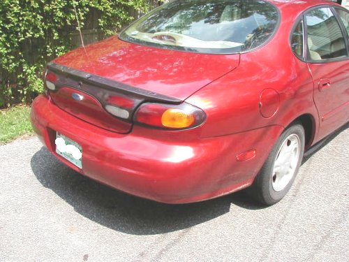 1997 Ford Taurus rear quarter panel and bumper, red paint
